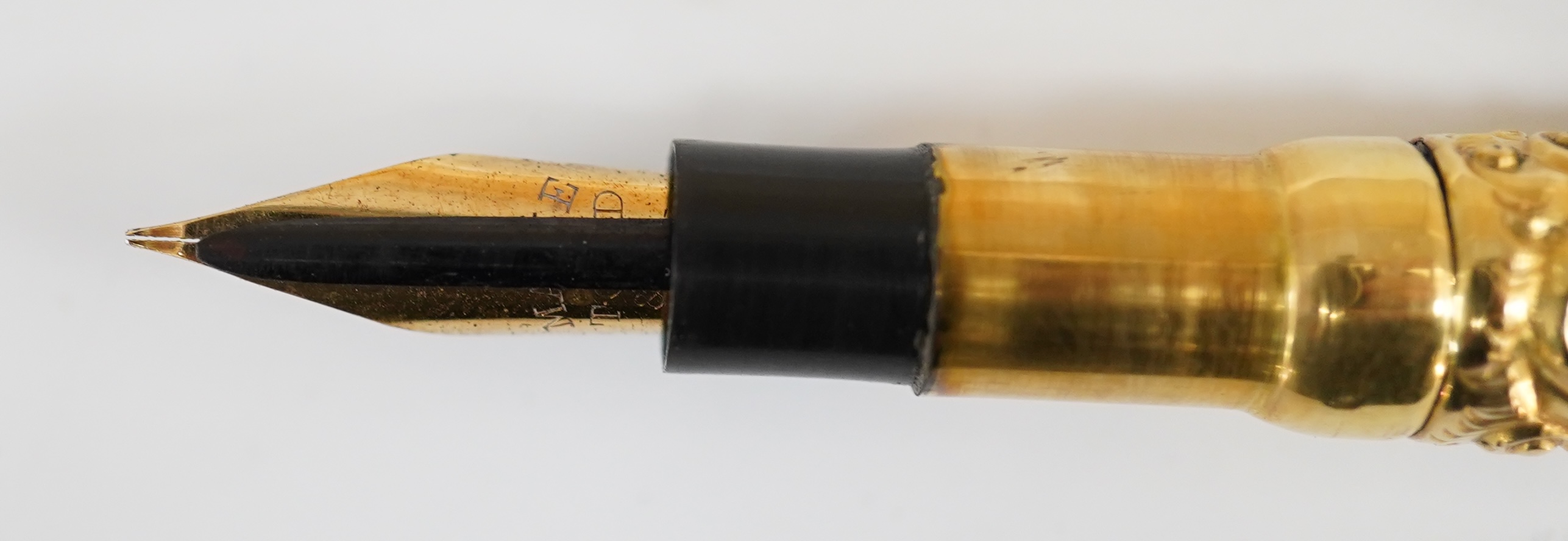 A Swan Mabie Todd & Bard Eyedropper in gold filled snail pattern, with over and under feed